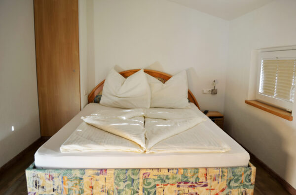 Haus Hofer - Schlafzimmer der Ferienwohnung in Bramberg am Wildkogel